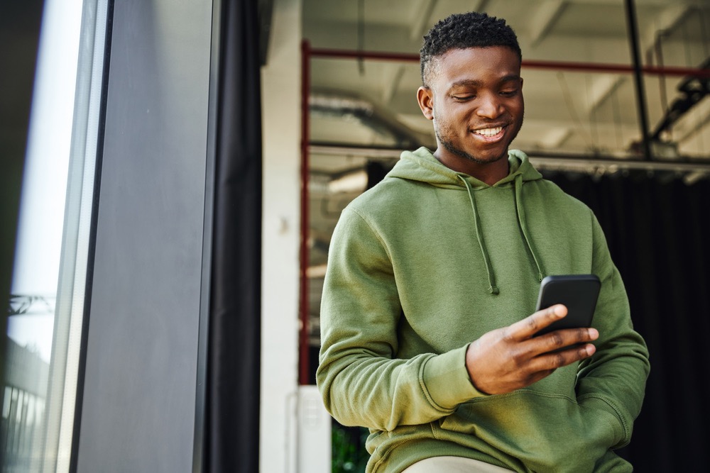 Man uses Android mobile phone