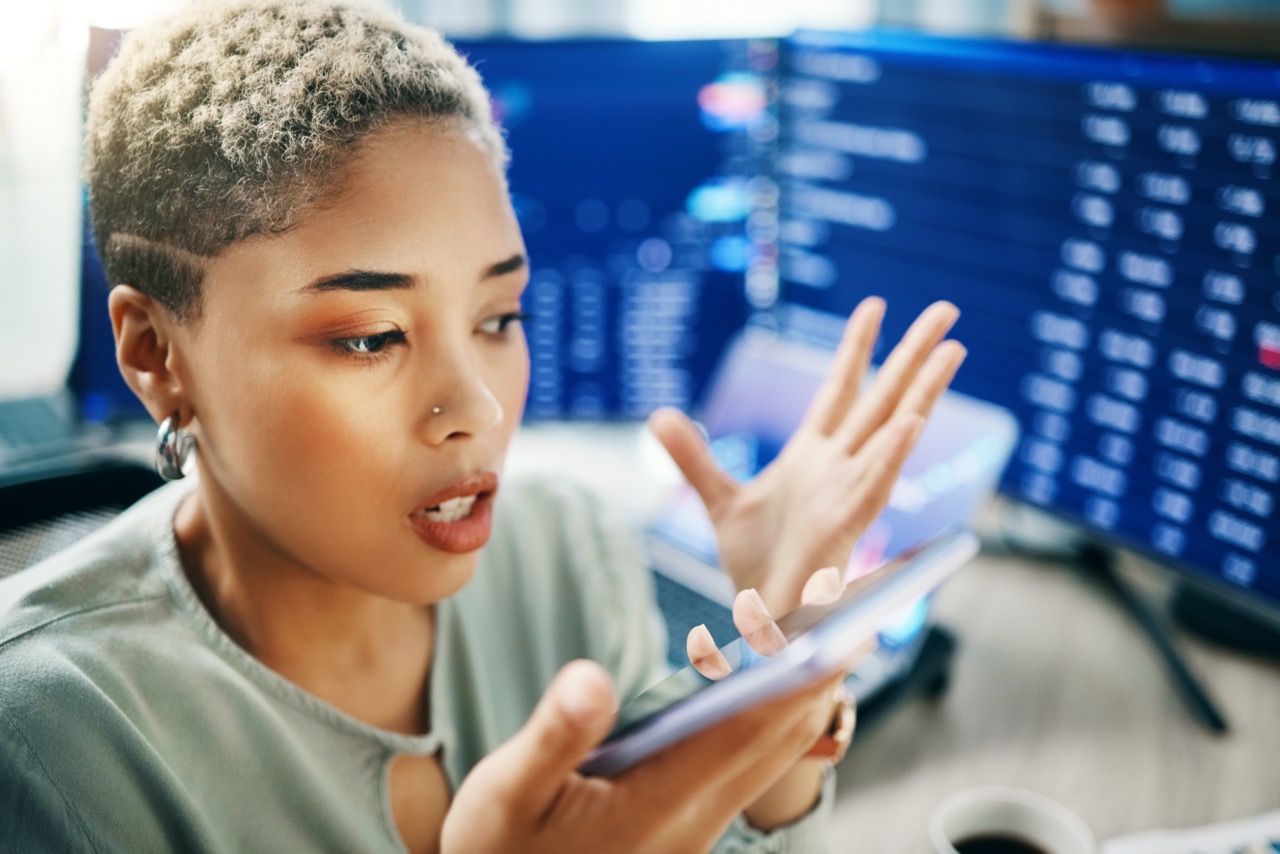 Frustrated business woman on phone during a cyber security incident